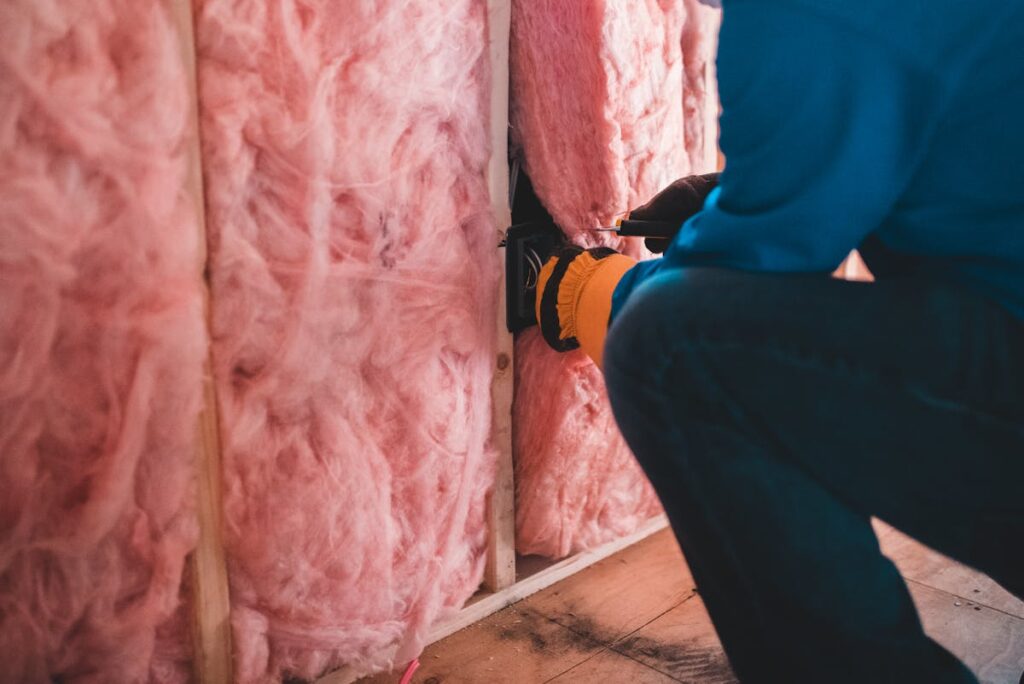 Insulation material being installed in a wall
